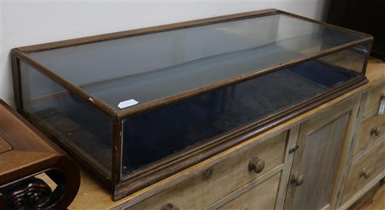 A table top display cabinet W.130cm